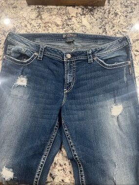 Silver Jeans Distressed Dark Blue Flare Jeans
